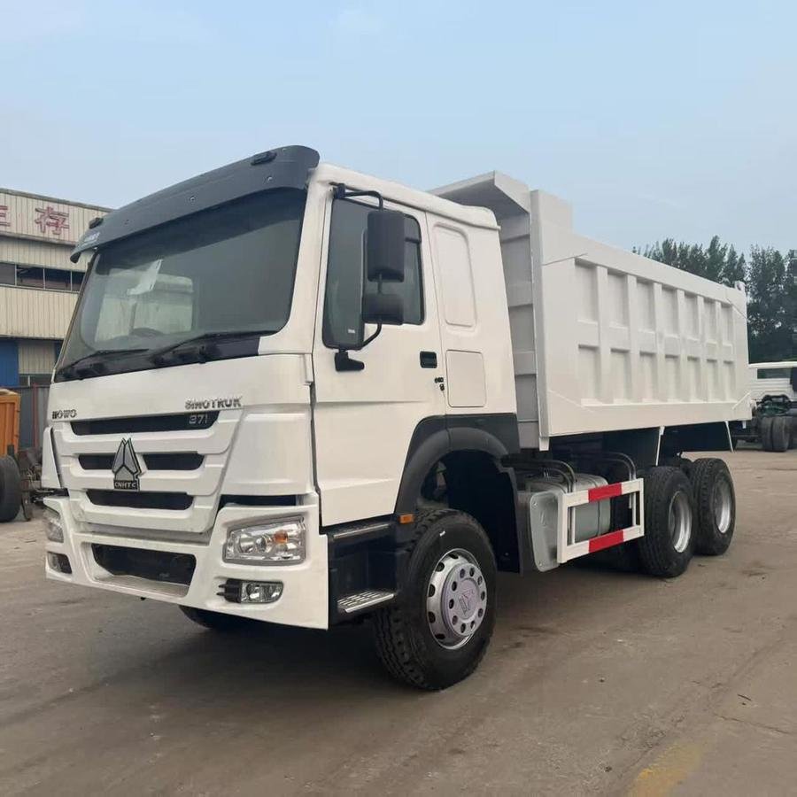 A white Sinotruk HOWO 371 tipper truck from the LAMM Investment haulage fleet.